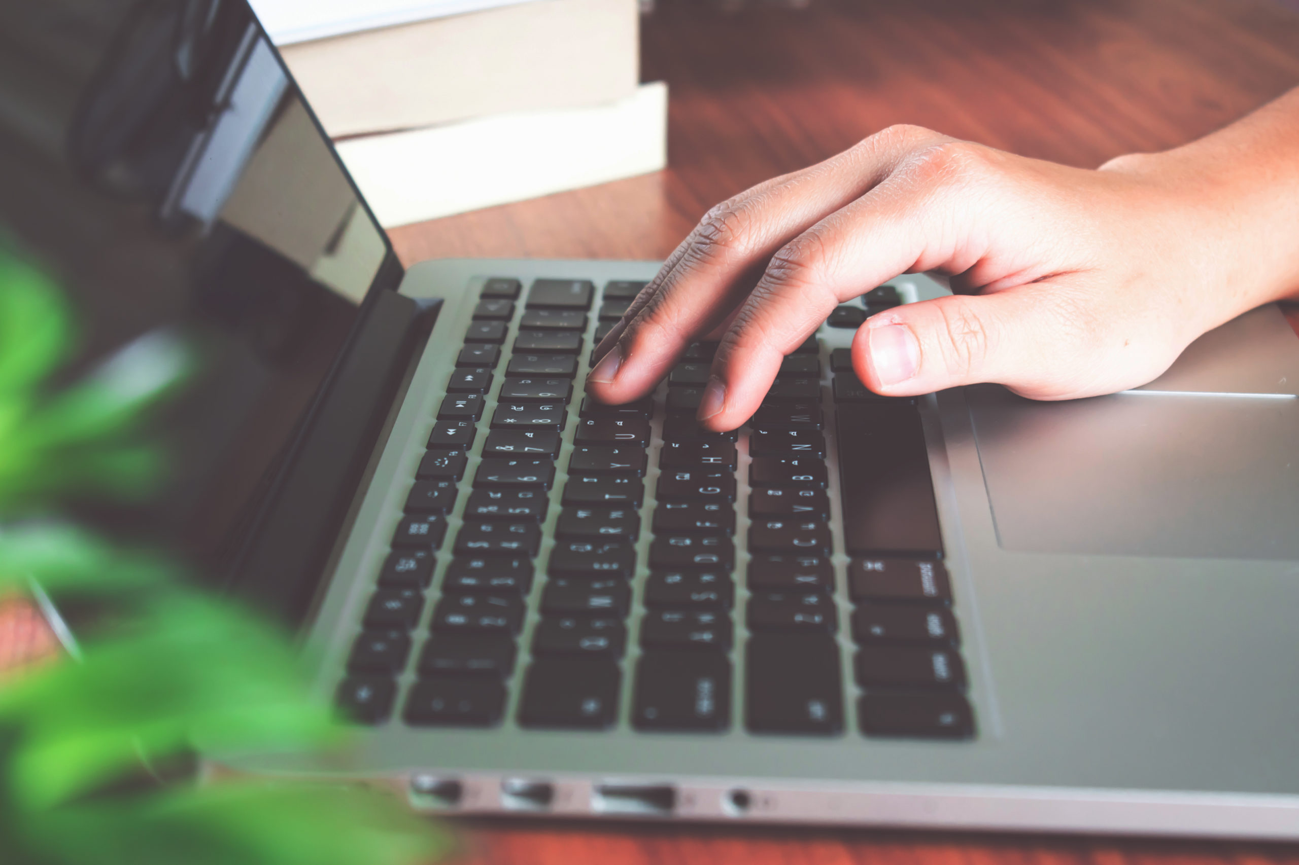 Women's hand searching the Internet.